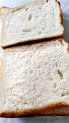 sliced bread in a plate on a wooden table