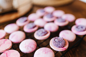 Bakery. Decoration of confectionery. Making macaroons. Pink macaroons. Biscuit