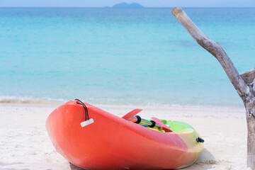 sea kayaks or multicolor boat on beautiful beach in Thailand