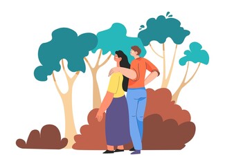 Couple strolling in woods, forest or park walking