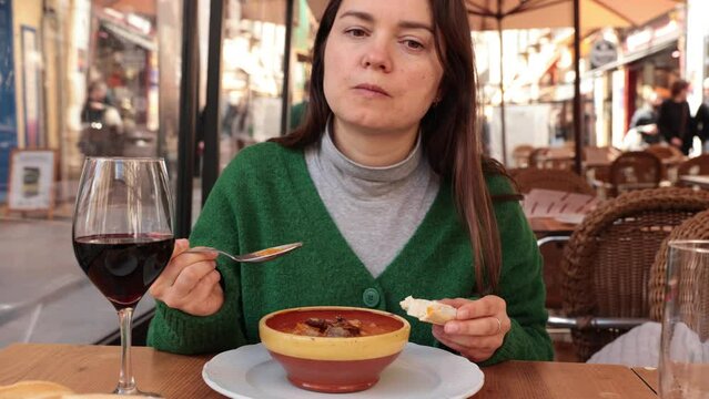Mashed potatoes dressed with garlic, cumin, paprika and bacon bits, a traditional dish from Spain known as patatas meneas. Salamanca. Spain. High quality 4k footage