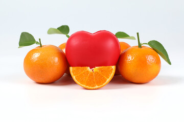 Orange, halved oranges, healthy fruit, mandarin, vitamin C, with red hearts placed on white background.