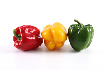 Fresh green sweet pepper yellow sweet pepper and red sweet pepper isolated on a white background. Green bell pepper. Red bell pepper. Yellow bell pepper.