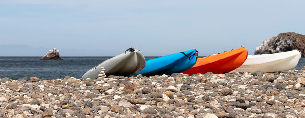 Kayaks on Scorpion bay rocky beach on Santa Cruz island in the Channel Islands National Park offshore from Santa Barbara California United States