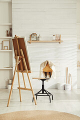 Modern studio interior with artist's workplace and decorative elements