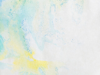 paper with blue green and yellow paint abstract