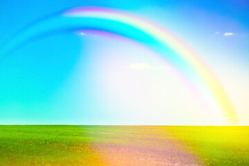 Obraz na płótnie Canvas Picturesque view of green meadow and beautiful rainbow in blue sky on sunny day