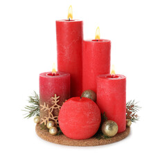 Burning red candles with Christmas decor isolated on white