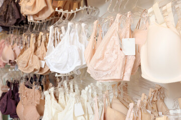 Many different beautiful women's underwear in lingerie store, closeup