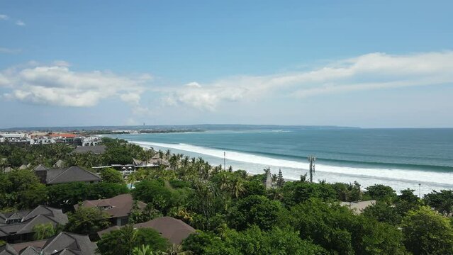 Legian Beach, Bali Island, Indonesia. Green Vegetation and Blue Ocean Water on Hot Sunny Day, Drone Shot