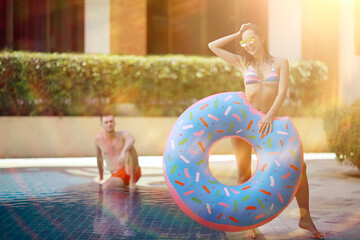 inflatable pool girl hotel girl / rest in a luxury hotel,  beautiful girl in  pool with an inflatable - obrazy, fototapety, plakaty