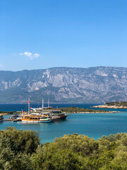 Fototapeta premium View from the mountain to the pier with yachts in the city of Marmaris