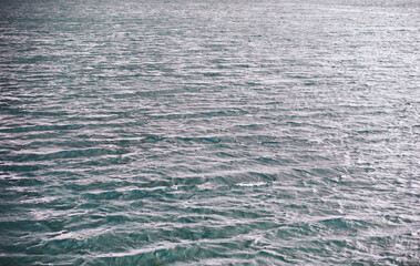 Water surface. The texture of the water. Waves on the lake in windy weather.