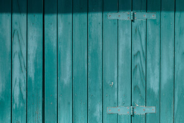 Fototapeta na wymiar green wooden boards with shadow as background