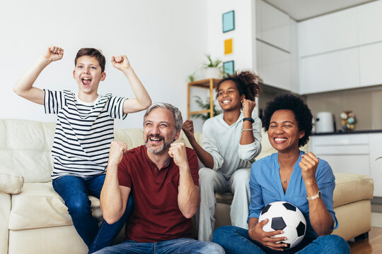 Excited Family Football Fans Watching Sport Tv Game Celebrating Goal Together
