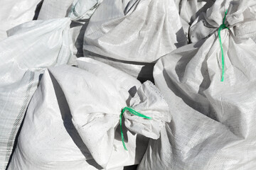 White polypropylene bulk bags, close up, industrial background