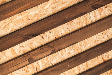Internal details of wooden roof, framework of brown boards