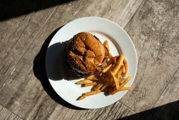 Home made hamburger with lettuce and cheese.