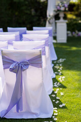 decorated chairs at the wedding ceremony, close-up