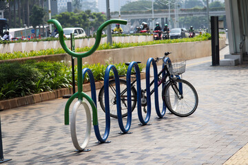 Fototapeta na wymiar bicycle parking in the form of a long bicycle that is available at statsiun MRT jakarta indonesia