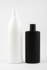 Black and white clean shampoo bottle isolated on white background