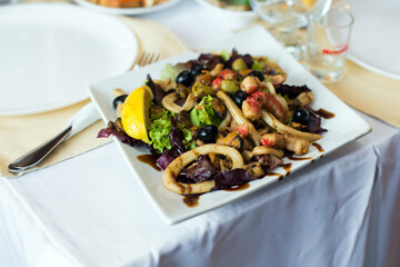 Salad with seafood on the banquet table