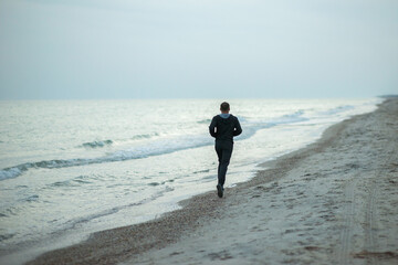 Man jogging on the seashore