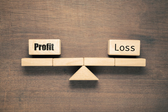 Profit and Loss (P&L) has equal weight on the balance scale symbol set by woodblocks