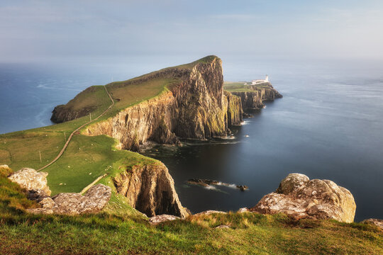 Isle of Skye lighthouse at Neist Point with beautiful golden light, beautiful landscape with sea - Scotland