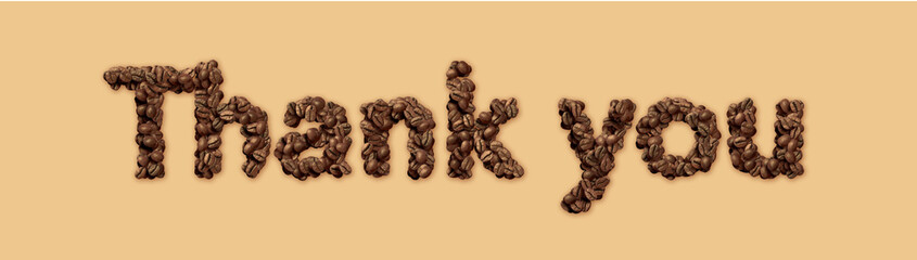 Coffee beans arranged in the word "Thank you"