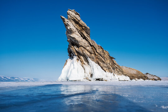 Dragon Tooth rock cape on frozen Lake Baikal, Ogoy Island, Siberia, Russia.
