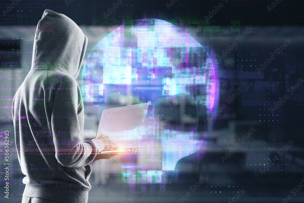 Poster hacker using laptop with abstract digital skull hologram on blurry office interior background. hacki