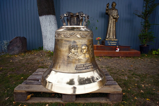 Minsk, Belarus. Sep 2018. Church Bell near the Church of St. Simeon and St. Helena, ready to mount into bell tower. Inscription - bell of Mother Olimpia Simeon and Helena.
