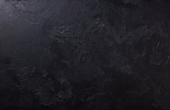 Natural black stone background pattern with high resolution. Top view. Copy space.