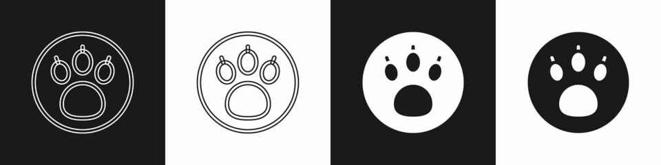 Set Paw search icon isolated on black and white background. Magnifying glass with animal footprints. Vector