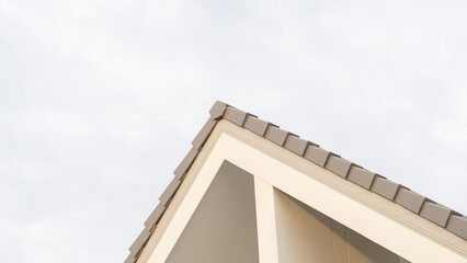 Fototapeta na wymiar close-up, low angle shot, top corner of a gable roof, of a modern house, beautiful, luxurious