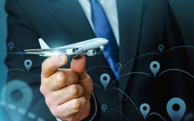 Passenger plane in businessmans hand. Commercial flight management and set new directions. Low cost...