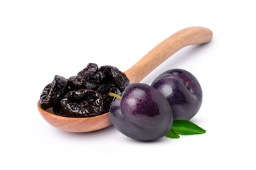 Dried prunes in wooden spoon and fresh fruit isolated on white background.