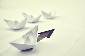 paper boats on the documents