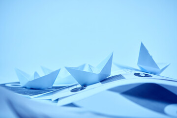 business concept, paper boats on the documents