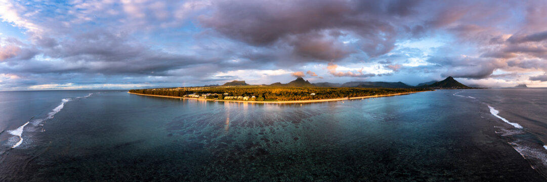Aerial shot of Flic En Flac beach with stormy clouds, Mauritius, Africa