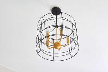 Fototapeta na wymiar Photograph of a cylindrical chandelier on the ceiling