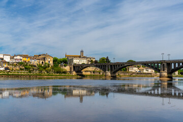 Fototapeta na wymiar view of the Dordogne River and old stone bridge leading to Bergerac
