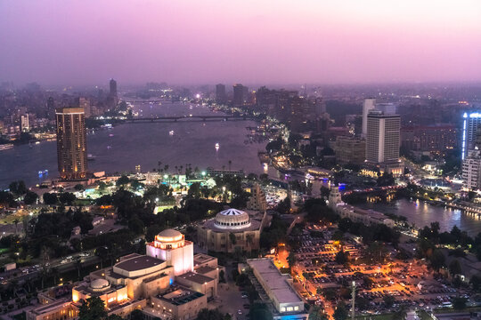Egypt, Cairo, View of Gezira island at dusk with Cairo Opera House in foreground and river Nile in background