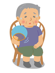 椅子に座ってうちわで扇ぐシニア男性