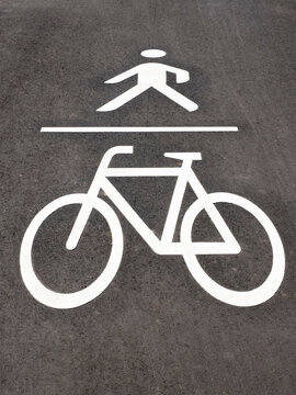 Sign of bicycle lane and pedestrian walkway on road