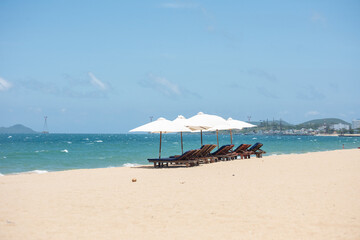 Nha Trang beach with umbrellas and chairs 