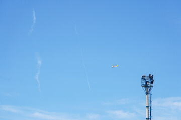 scaffolding with antennas on a blue background.