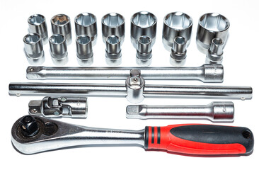 A set of new tools on a white background. Set of adjustable wrenches with handle holder, adapters...