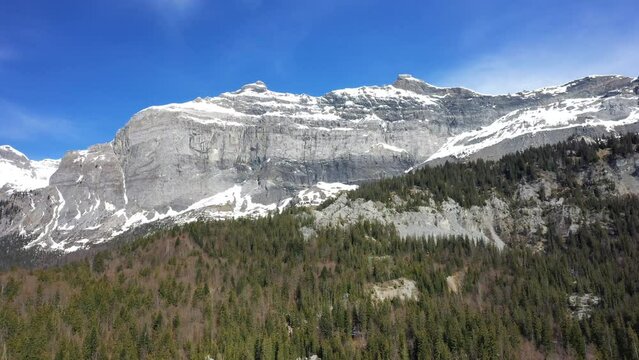 Snow capped rocks in the Mont Blanc massif in Europe, France, the Alps, towards Chamonix, in spring, on a sunny day.